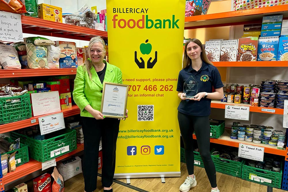 Christine Presents Volunteer Award At Food Bank